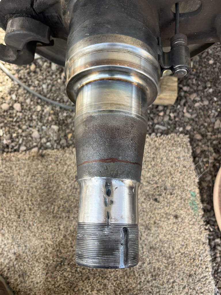 Heavy-duty truck undergoing spindle repair at AZ Axle Medic.