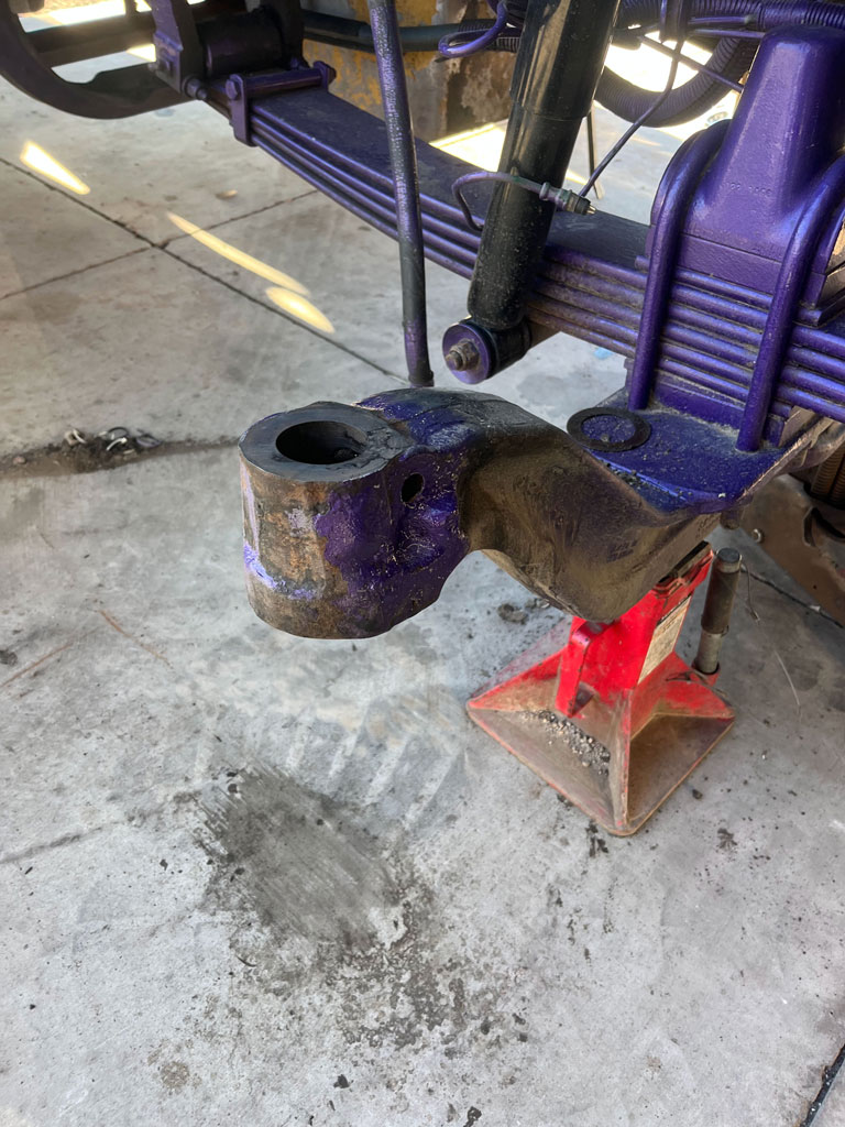 Heavy-duty truck undergoing axle eye repair at AZ Axle Medic.