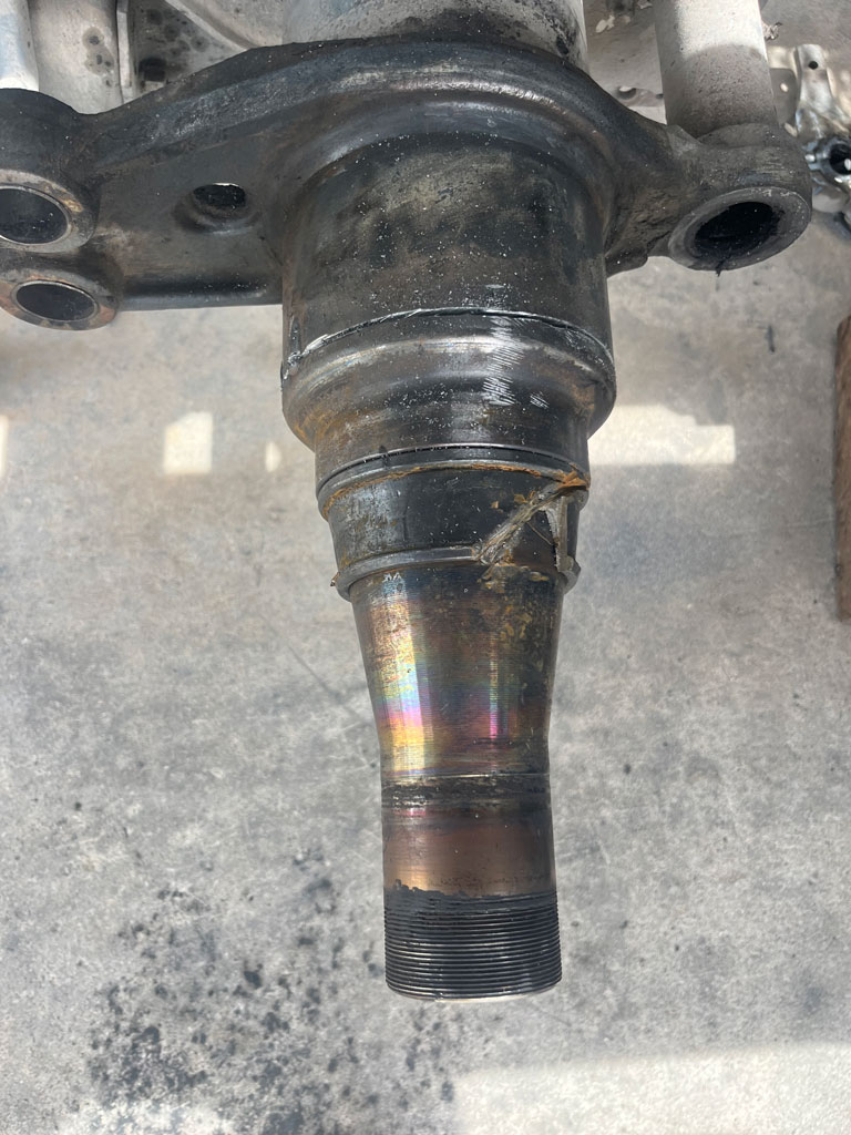 Heavy-duty truck undergoing spindle repair at AZ Axle Medic.