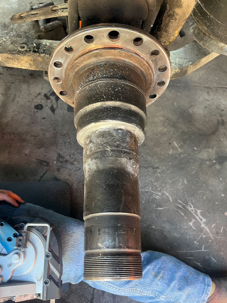 Heavy-duty truck undergoing spindle repair at AZ Axle Medic.