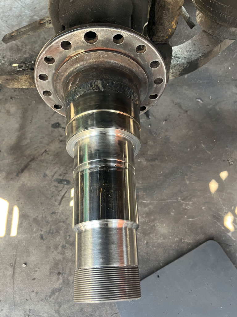 Heavy-duty truck undergoing spindle repair at AZ Axle Medic.