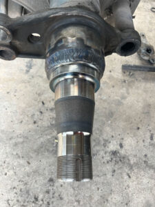 Home 7 Heavy-duty truck undergoing spindle repair at AZ Axle Medic.