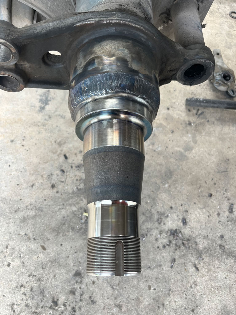 Heavy-duty truck undergoing spindle repair at AZ Axle Medic.